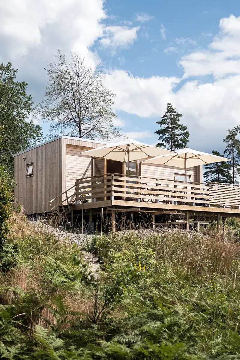 Holiday cabin with wood panel on a hill
